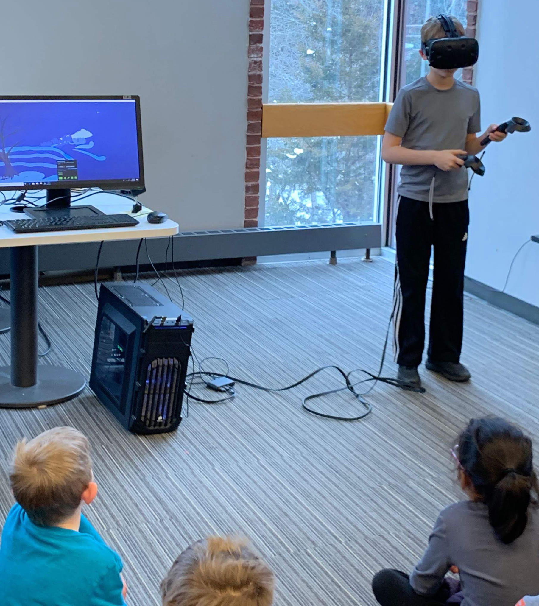 Child wears VR Headset, exploring VR